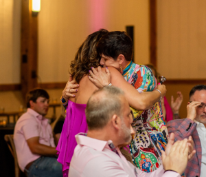 breast cancer survivors hugging